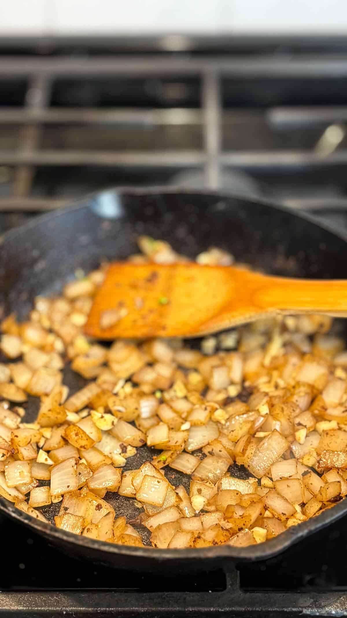 Sauteing onions and garlic in a pan.