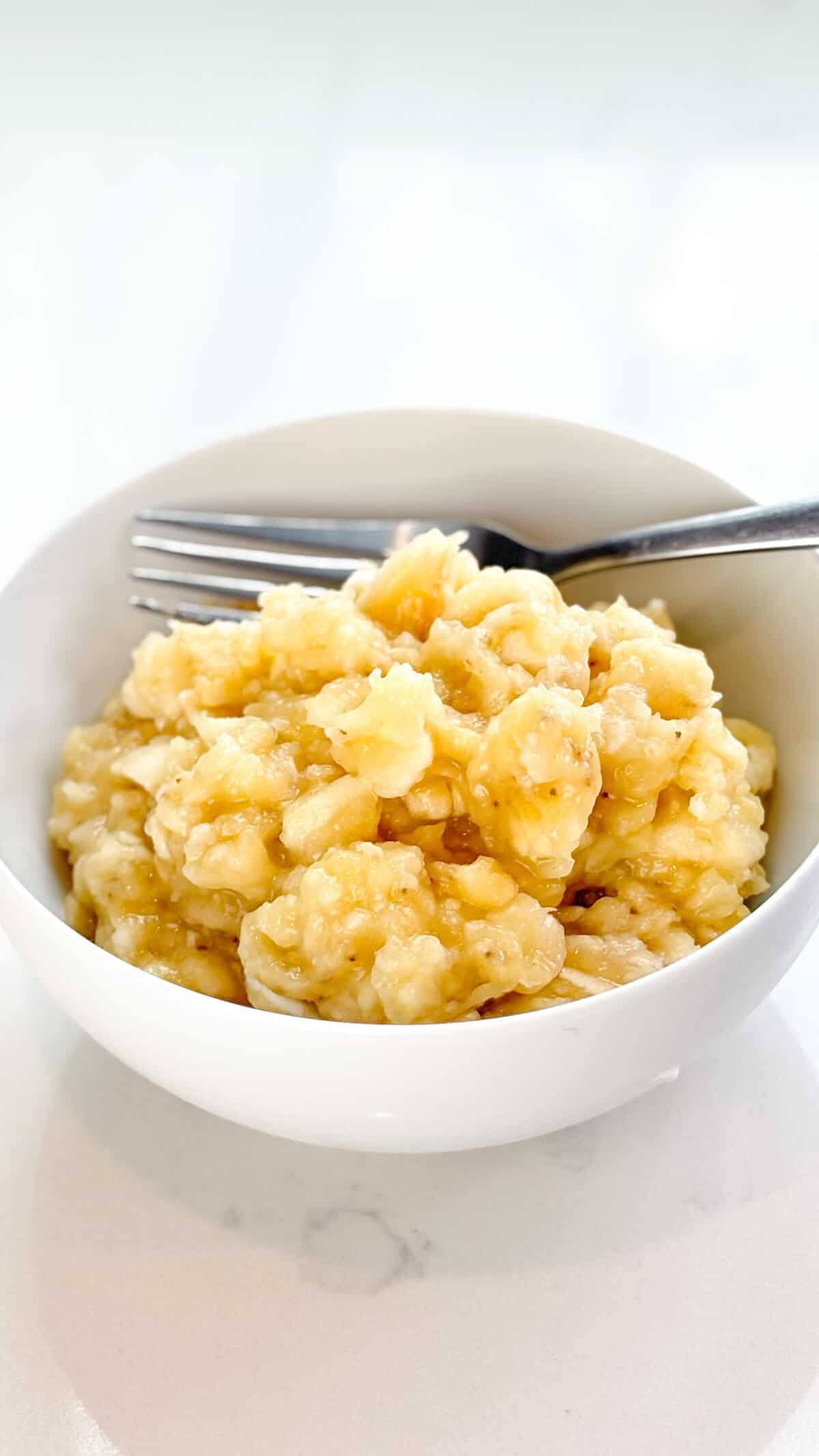 Bananas mashed in a bowl.