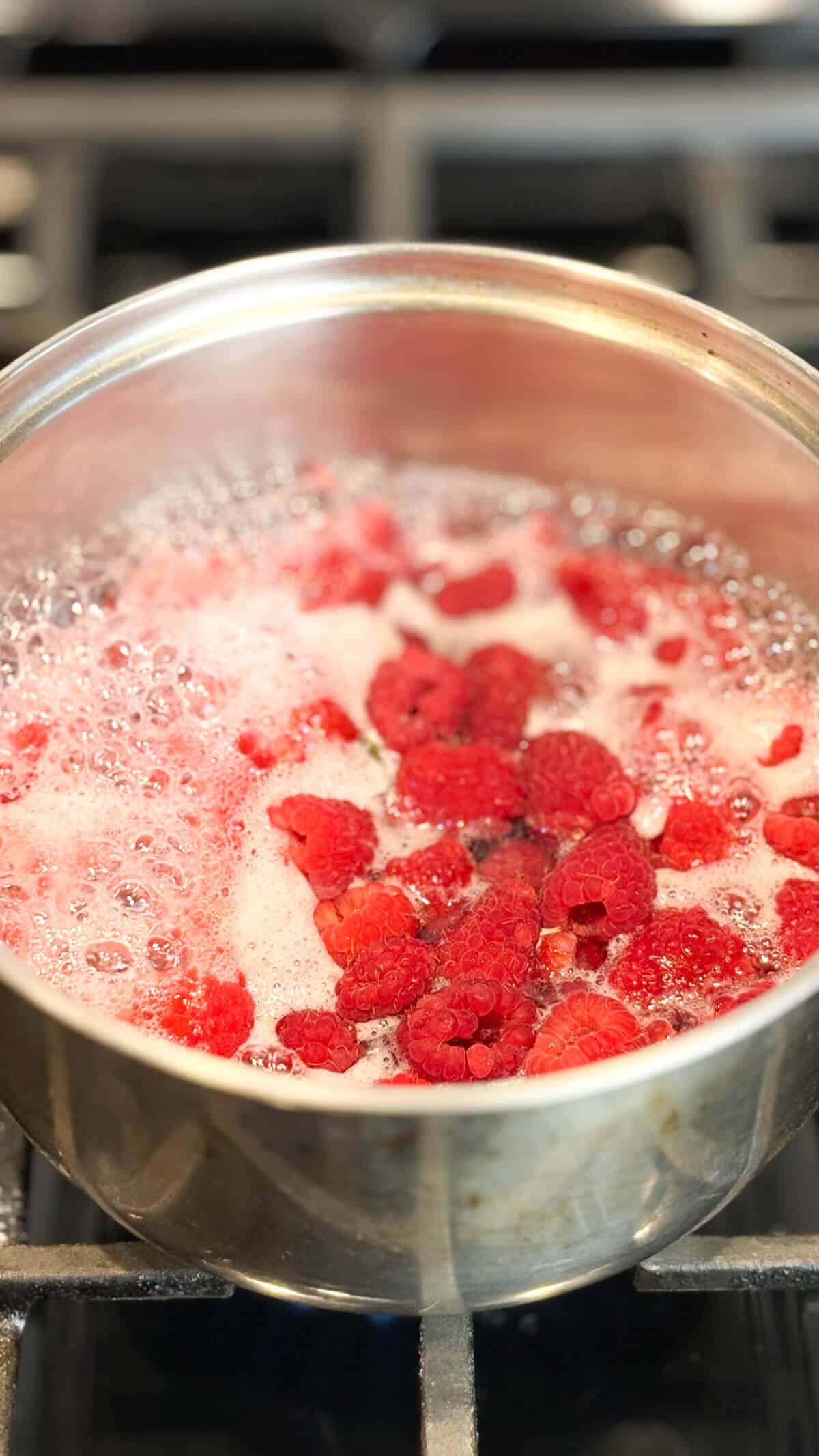 Syrup simmering in a pot on the stove.