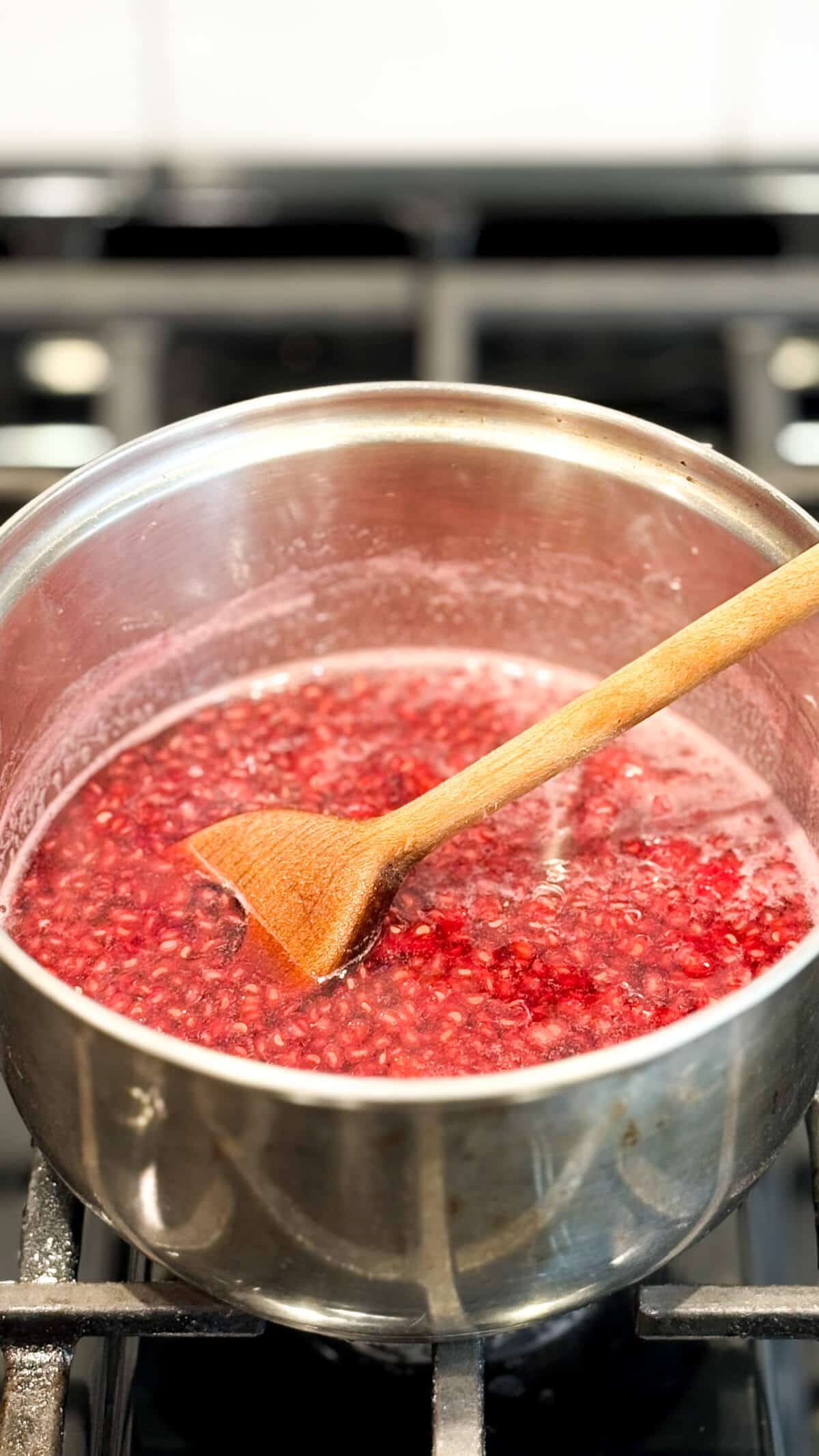Stirring in a pot on the stove.