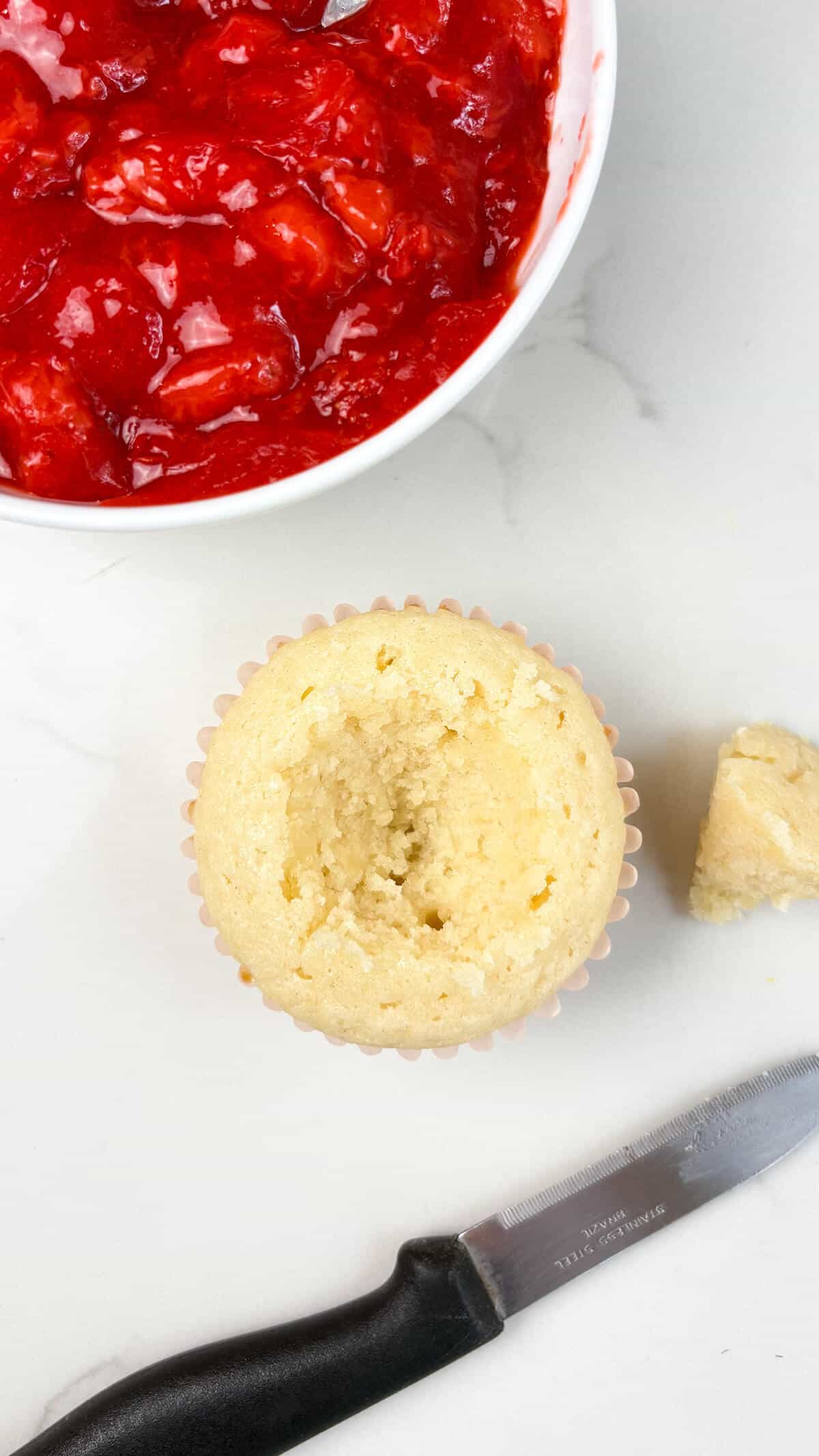 Piece of cupcake cut out for the filling.